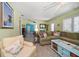 Inviting living room with comfortable seating, terrazzo floors, and coastal-themed decorations at 301 Cevera Dr, Dunedin, FL 34698