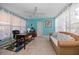 Bright office with a ceiling fan, desk, and comfortable seating at 301 Cevera Dr, Dunedin, FL 34698