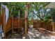 Outdoor shower with tropical foliage and wood enclosure at 301 Cevera Dr, Dunedin, FL 34698