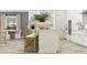 Bright kitchen showcasing an island with seating, complemented by white cabinetry and modern appliances at 31616 Cardinal Yard Dr, San Antonio, FL 33576