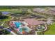 Resort-style community featuring pool, tennis courts, clubhouse, and lush landscaping at 3312 Francoa Dr, Odessa, FL 33556