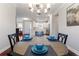 Charming dining area with view into modern kitchen, perfect for entertaining guests in style at 3312 Francoa Dr, Odessa, FL 33556