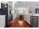 Bright kitchen with stainless appliances, a breakfast bar, and view into the dining area at 3312 Francoa Dr, Odessa, FL 33556