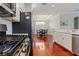 Kitchen features stainless steel appliances, white cabinets, and a view of the adjacent dining area at 3312 Francoa Dr, Odessa, FL 33556