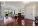Bright living room with hardwood floors, large sliding glass doors, and stylish furniture at 3312 Francoa Dr, Odessa, FL 33556