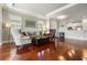 Comfortable living room with hardwood floors, bright windows, and an open-concept layout at 3312 Francoa Dr, Odessa, FL 33556