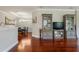 Open-concept living area featuring elegant hardwood floors and neutral wall color at 3312 Francoa Dr, Odessa, FL 33556