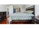 Comfortable main bedroom with wood floors, large bed, and ample storage space at 3312 Francoa Dr, Odessa, FL 33556