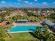 Aerial view of community pool featuring lounge chairs and palm trees at 3312 Francoa Dr, Odessa, FL 33556