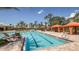 A luxurious swimming pool featuring sun loungers and cabanas at 3312 Francoa Dr, Odessa, FL 33556