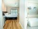 Bright open view into bedroom with a bath featuring a large soaking tub and plantation shutters at 3516 W Santiago St, Tampa, FL 33629