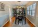 Formal dining room with hardwood floors, chair rail molding, and chandelier at 3516 W Santiago St, Tampa, FL 33629