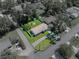 Aerial view of a beautiful home with a well-maintained yard, including a fire pit and storage shed at 37153 Mcminn Ave, Dade City, FL 33525