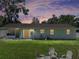 Backyard view featuring a fire pit with chairs and an external storage shed at 37153 Mcminn Ave, Dade City, FL 33525