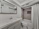 Updated bathroom with a modern vanity, tile flooring, and shower-tub combination at 37153 Mcminn Ave, Dade City, FL 33525