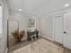 Well-lit bedroom with decorative vanity and ample natural light, wood-look floors, and closet space at 37153 Mcminn Ave, Dade City, FL 33525