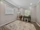 Bright bedroom with a vintage vanity, spacious layout, and stylish wood-look floors at 37153 Mcminn Ave, Dade City, FL 33525
