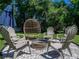 Backyard fire pit area with comfortable seating, perfect for outdoor entertaining and relaxing evenings at 37153 Mcminn Ave, Dade City, FL 33525