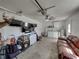 Open garage with seating and appliances, perfect for storage and activities at 37153 Mcminn Ave, Dade City, FL 33525