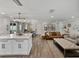 Open-concept living space showcasing the kitchen island, dining area, and comfortable seating area at 37153 Mcminn Ave, Dade City, FL 33525