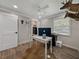 Unique office space with a white desk, wood-look floors and distinctive decor at 37153 Mcminn Ave, Dade City, FL 33525