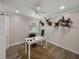 Inviting home office with wood-look floors, ample lighting, and unique decor at 37153 Mcminn Ave, Dade City, FL 33525