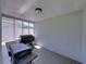An outdoor patio with views of neighboring homes through screened windows at 37153 Mcminn Ave, Dade City, FL 33525