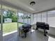The back porch leads to a backyard with storage and seating at 37153 Mcminn Ave, Dade City, FL 33525