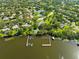 Lakeside community aerial showcasing the community with docks and boat slips on a river at 3772 Woodridge Pl, Palm Harbor, FL 34684