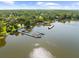 Lakeside community aerial view showcasing the dock and boat slips on a sunny day at 3772 Woodridge Pl, Palm Harbor, FL 34684