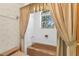 Cozy bathroom showcases a tiled shower and tub with a curtained window at 3772 Woodridge Pl, Palm Harbor, FL 34684