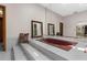 Elegant bathroom features a red tub, marble steps, and ornate mirror at 3772 Woodridge Pl, Palm Harbor, FL 34684