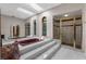 Luxurious bathroom featuring a sunken tub, shower, and skylights at 3772 Woodridge Pl, Palm Harbor, FL 34684