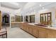 Large bathroom featuring double sinks, large mirrors, and a makeup vanity at 3772 Woodridge Pl, Palm Harbor, FL 34684