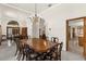 Dining room features seating for eight, a large mirror, and access to other rooms at 3772 Woodridge Pl, Palm Harbor, FL 34684