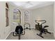 Exercise room with equipment and arched windows at 3772 Woodridge Pl, Palm Harbor, FL 34684