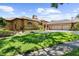 Lovely brick home features a three-car garage, arched entryway, well-manicured lawn, and mature landscaping at 3772 Woodridge Pl, Palm Harbor, FL 34684