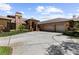 Charming brick home features a three-car garage, beautiful arched entryway, and well-maintained landscaping at 3772 Woodridge Pl, Palm Harbor, FL 34684