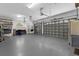 Spacious three car garage with ample storage and work space at 3772 Woodridge Pl, Palm Harbor, FL 34684