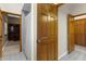 Hallway offers access to the bathroom with a shower, a study, and closet at 3772 Woodridge Pl, Palm Harbor, FL 34684