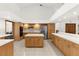 Spacious kitchen with island, stainless steel appliances, and ample cabinet storage at 3772 Woodridge Pl, Palm Harbor, FL 34684
