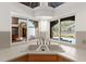 The kitchen sink has a backyard view of the home's pool and patio area at 3772 Woodridge Pl, Palm Harbor, FL 34684