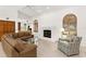 Spacious living room with high ceilings, fireplace, and arched windows offering natural light at 3772 Woodridge Pl, Palm Harbor, FL 34684