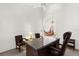 Bright office space with a large desk and view to the living room at 3772 Woodridge Pl, Palm Harbor, FL 34684