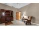 Traditional office featuring a wooden bookcase desk, chair, accent chair and neutral walls at 3772 Woodridge Pl, Palm Harbor, FL 34684