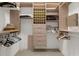 Walk-in closet with custom shelving and storage at 3772 Woodridge Pl, Palm Harbor, FL 34684