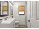 Bathroom featuring a white vanity, neutral walls, wood-look floors, and a shower curtain at 39 Bishop Creek Dr, Safety Harbor, FL 34695