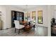 Bright dining room with a classic wooden table, bench seating, and stylish decor for elegant gatherings at 39 Bishop Creek Dr, Safety Harbor, FL 34695