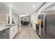 Bright kitchen with stainless steel appliances and a view of the living room at 39 Bishop Creek Dr, Safety Harbor, FL 34695