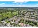 Aerial view showcasing a suburban community with green spaces, manicured lawns and tree lined streets at 406 Laguna Mill Dr, Ruskin, FL 33570